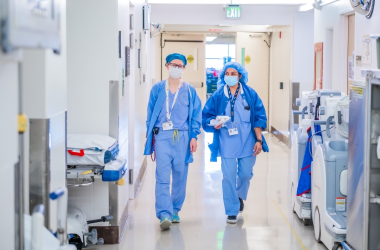 two doctors walking down a hallway