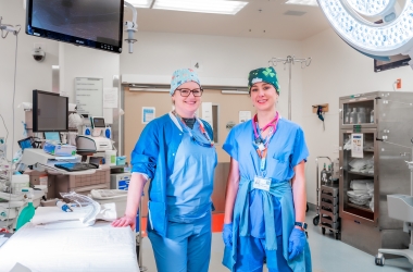 two doctors smiling into the camera