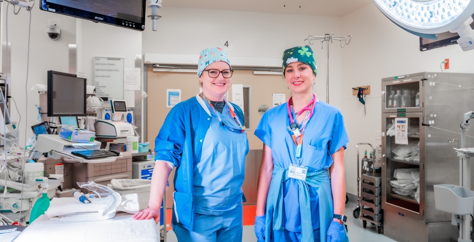 two doctors smiling into the camera