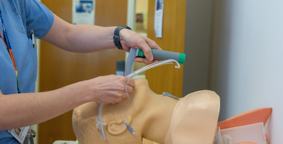 A resident practicing intubation on a dummy in the Anesthesia Parnassus Skills Lab