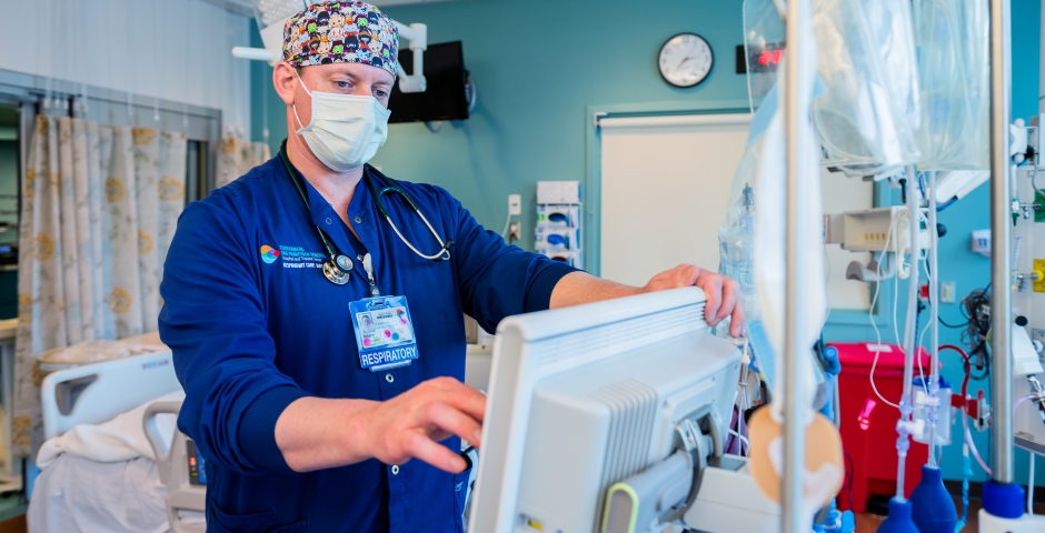 respiratory care therapist in a hospital room.