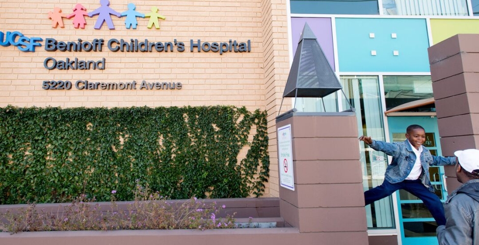 outside the BCH Oakland building, a kid jumps into his dad's arms