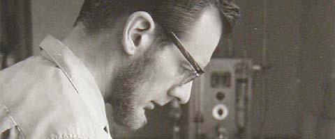 Dr. John Severinghaus looking at the first blood gas analyzer (he invented). Circa 1960.