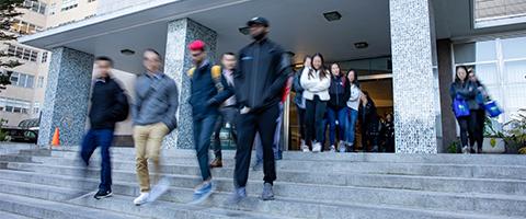 blurred photo of UCSF students exiting the Medical Sciences Building at 513 Parnassus Ave