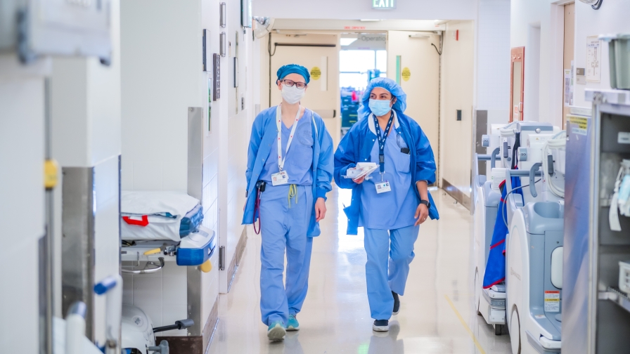 two doctors walking down a hallway