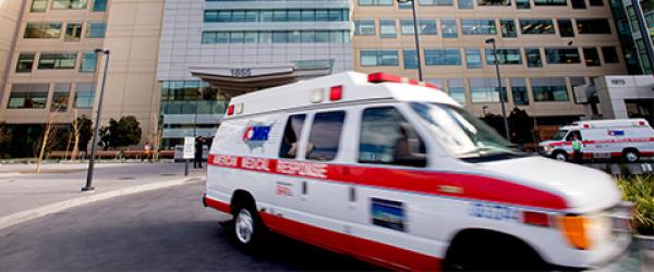 Ambulance leaving hospital parking lot
