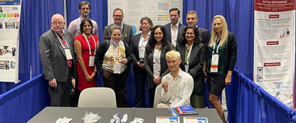Billy Nguyen and others at the UCSF Health booth at the ASA exhibit hall
