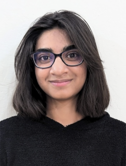 women with dark shoulder length hair wearing glasses