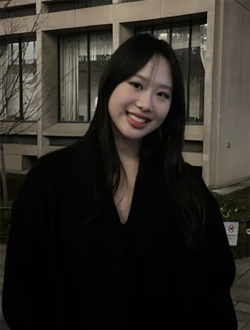 Women wearing black coat smiling at camera