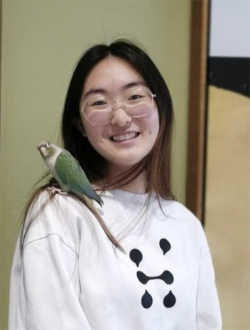 Women with bird on shoulder