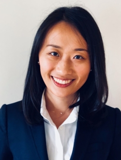 woman in blue blazer and white shirt.