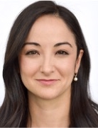 Woman with long dark brown hair.