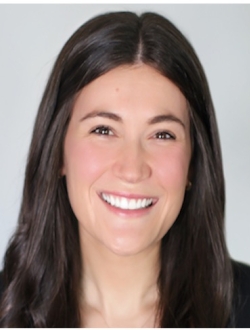 Smiling woman with long brown hair.