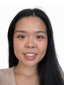 Smiling woman with long black hair.