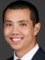 Smiling man with short black hair.