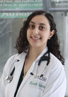 Women with curly hair wearing lab coat and stethoscope