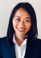 woman in blue blazer and white shirt.