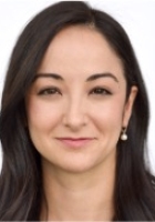 Woman with long dark brown hair.