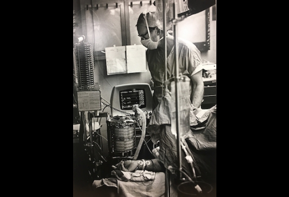 Dr. John Severinghaus in the operating room at UCSF Moffitt Hospital with a terminal of his remote mass spectrometer anesthetic analysis system. From Scientific American, 1985.