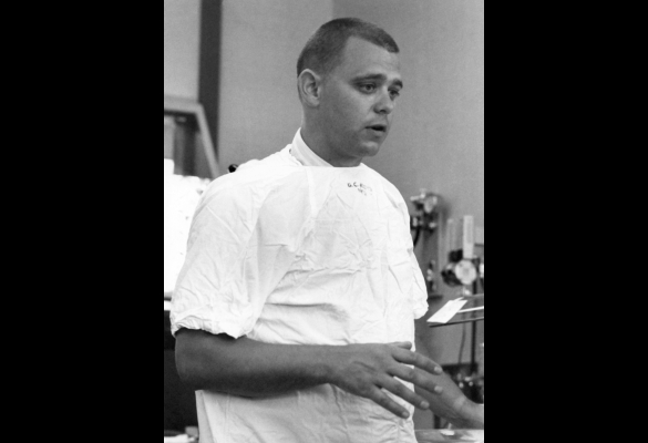 Young Dr. George Gregory wearing a scrub top.