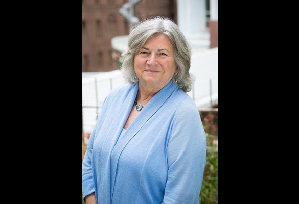 Portrait of Sue Carlisle in light blue top.