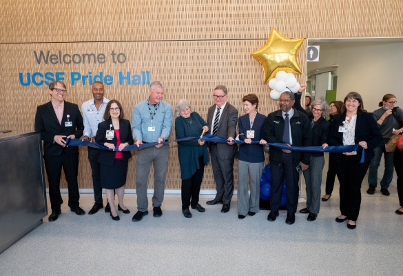 Sue Carlisle, MD, PhD, middle, with UCSF and ZSFG leaders, cutting the ribbon to open Pride Hall at ZSFG