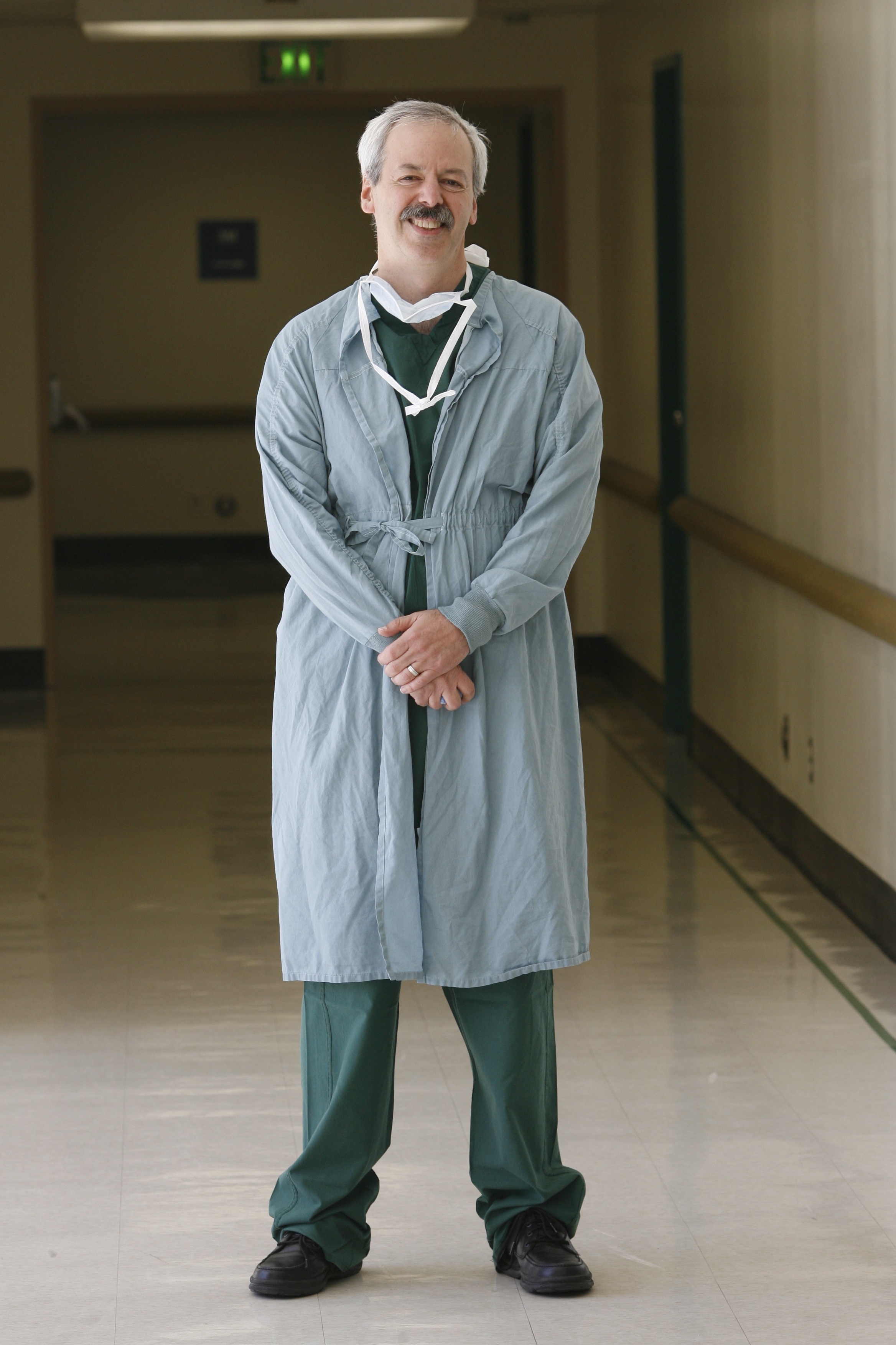 Jim Marks, MD, PhD, standing in the hallway at Zuckerberg San Francisco General Hospital. Photo Courtesy Brant Ward.