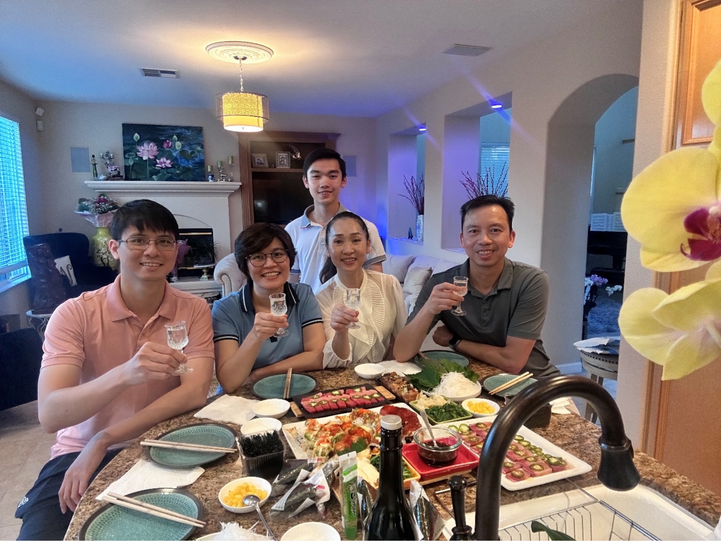 group of people at home with dinner
