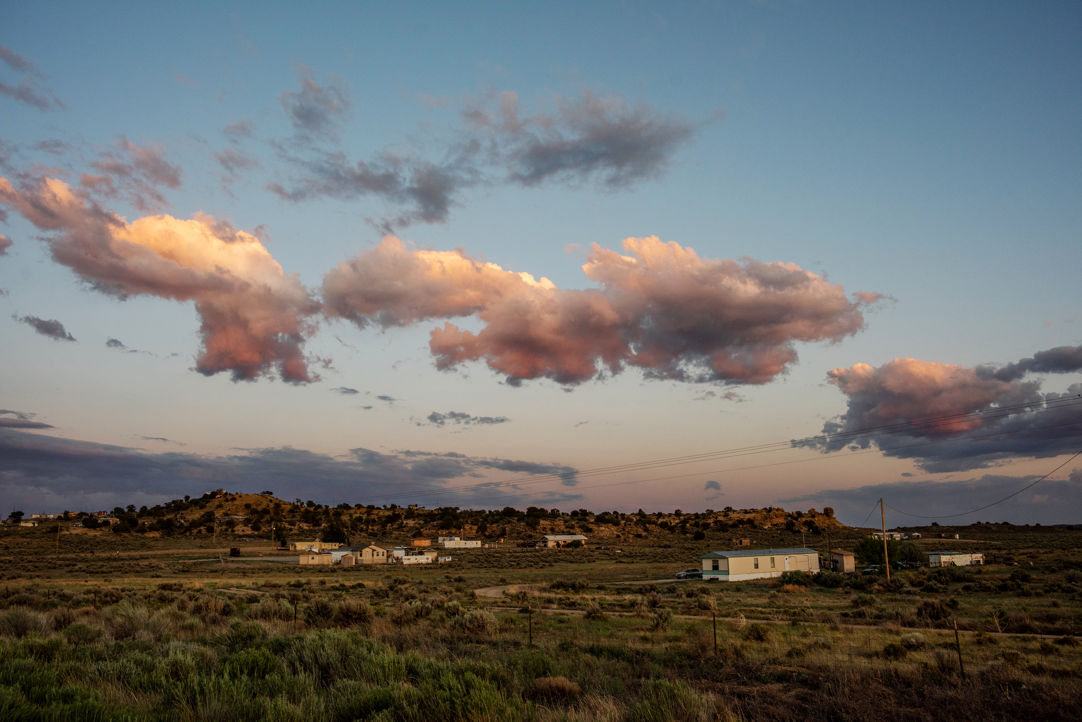 Clouds at sunset, lit from above and floating over the Navajo Nation