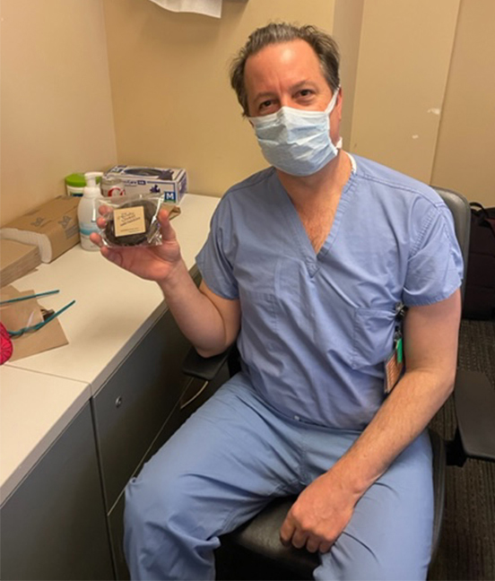 Dr. Stephen Weston with a Doctors Day appreciation cookie
